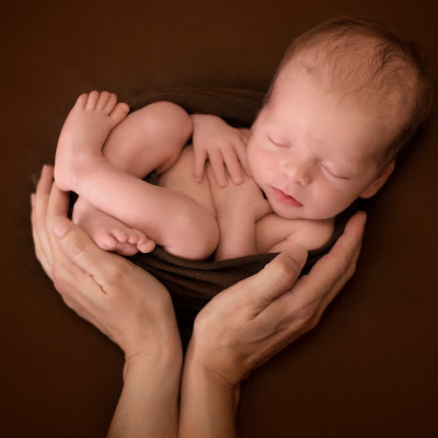 Logotip de Pasitos Newborn Photography
